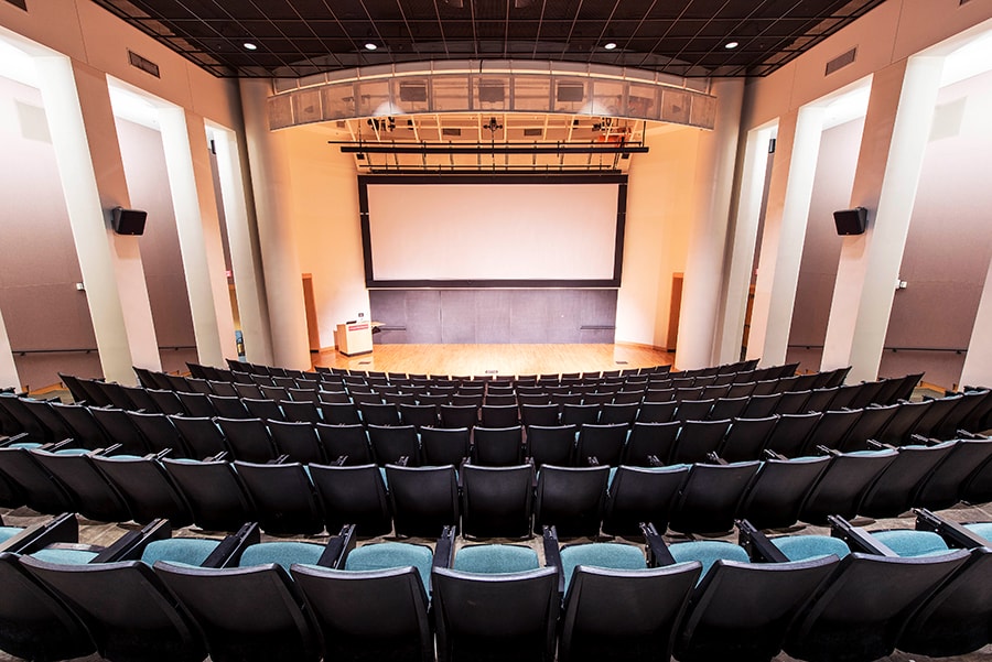 Photo of McConomy Auditorium from mid-theater with a view towards the stage